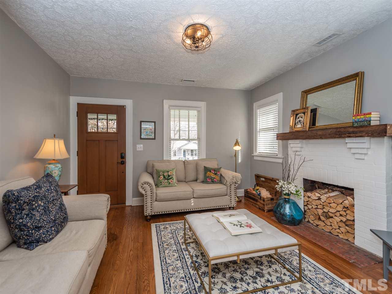 612 North Boundary Street Raleigh, NC 27604 - Photo 7 of 28 a living room with furniture and a lamp