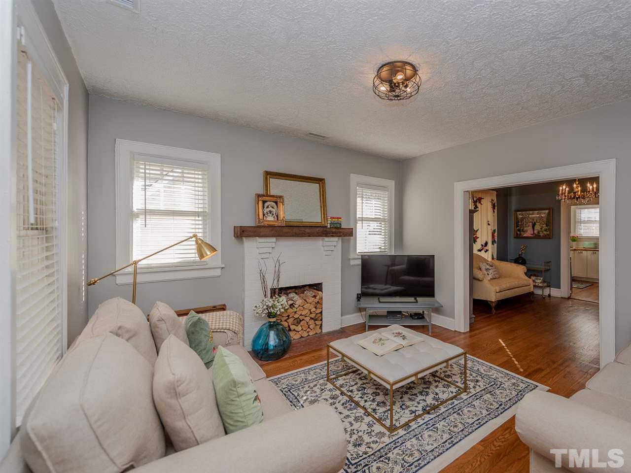 612 North Boundary Street Raleigh, NC 27604 - Photo 9 of 28 a living room with furniture and a fireplace