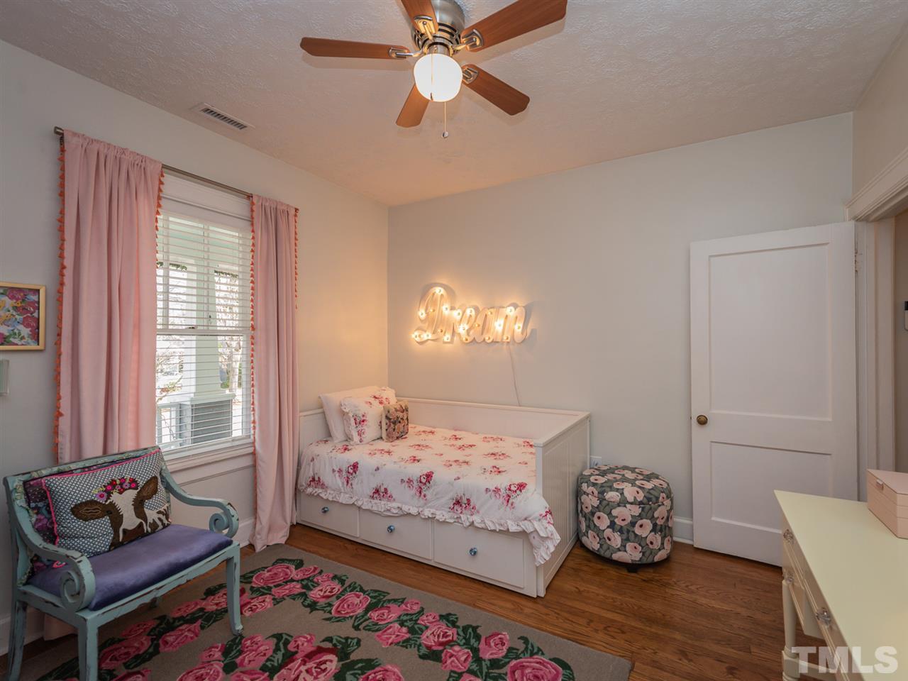 612 North Boundary Street Raleigh, NC 27604 - Photo 10 of 28 a bedroom with bed and window