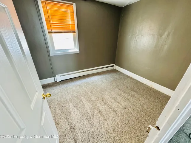 a view of a room with a window