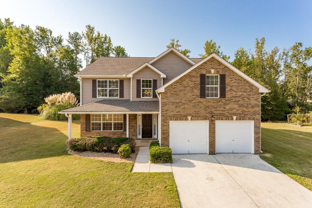 front view of a house with a yard