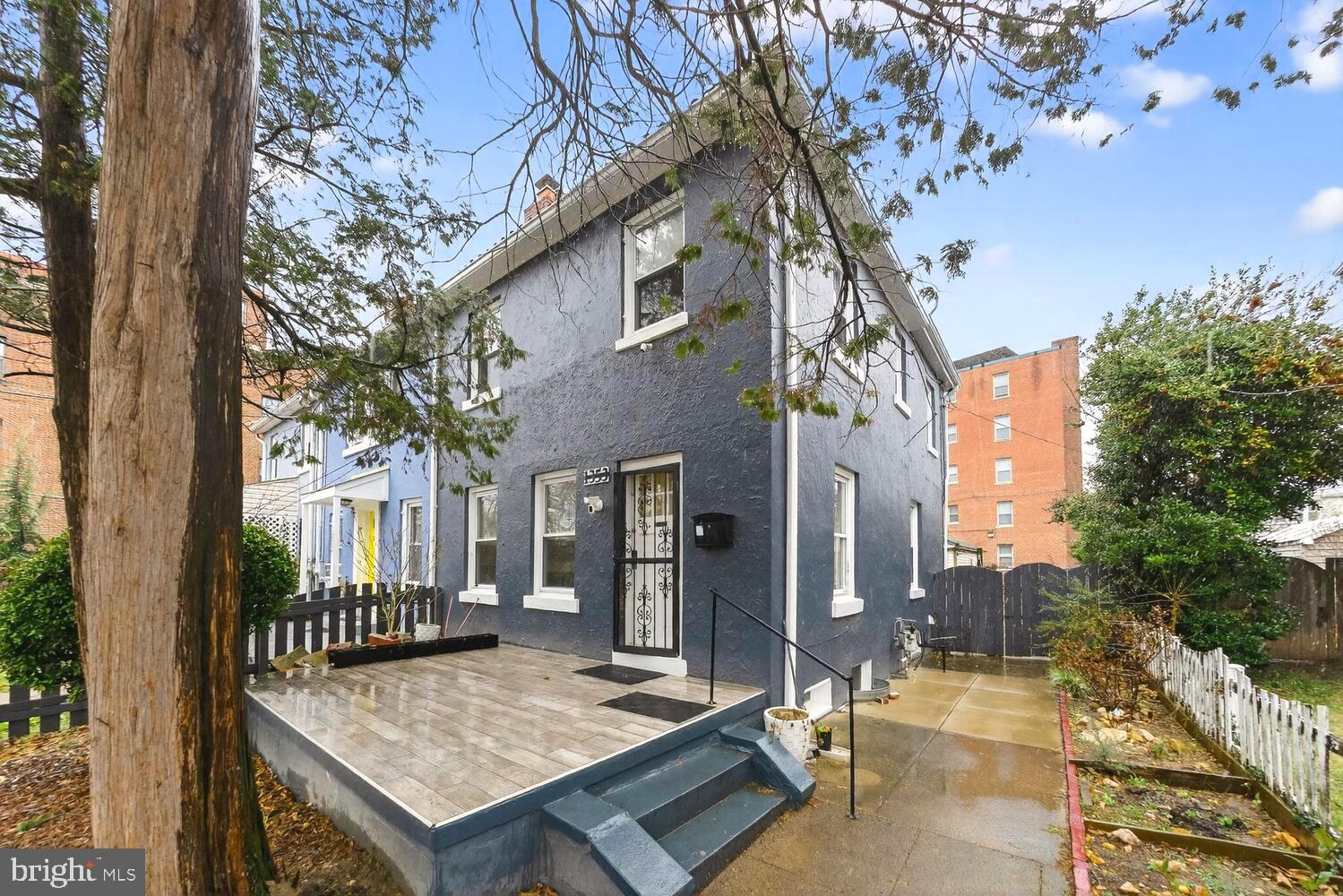 1353 Kennedy Street Northwest Washington, DC 20011 - Photo 1 of 32 a view of a dinning table and chairs in patio