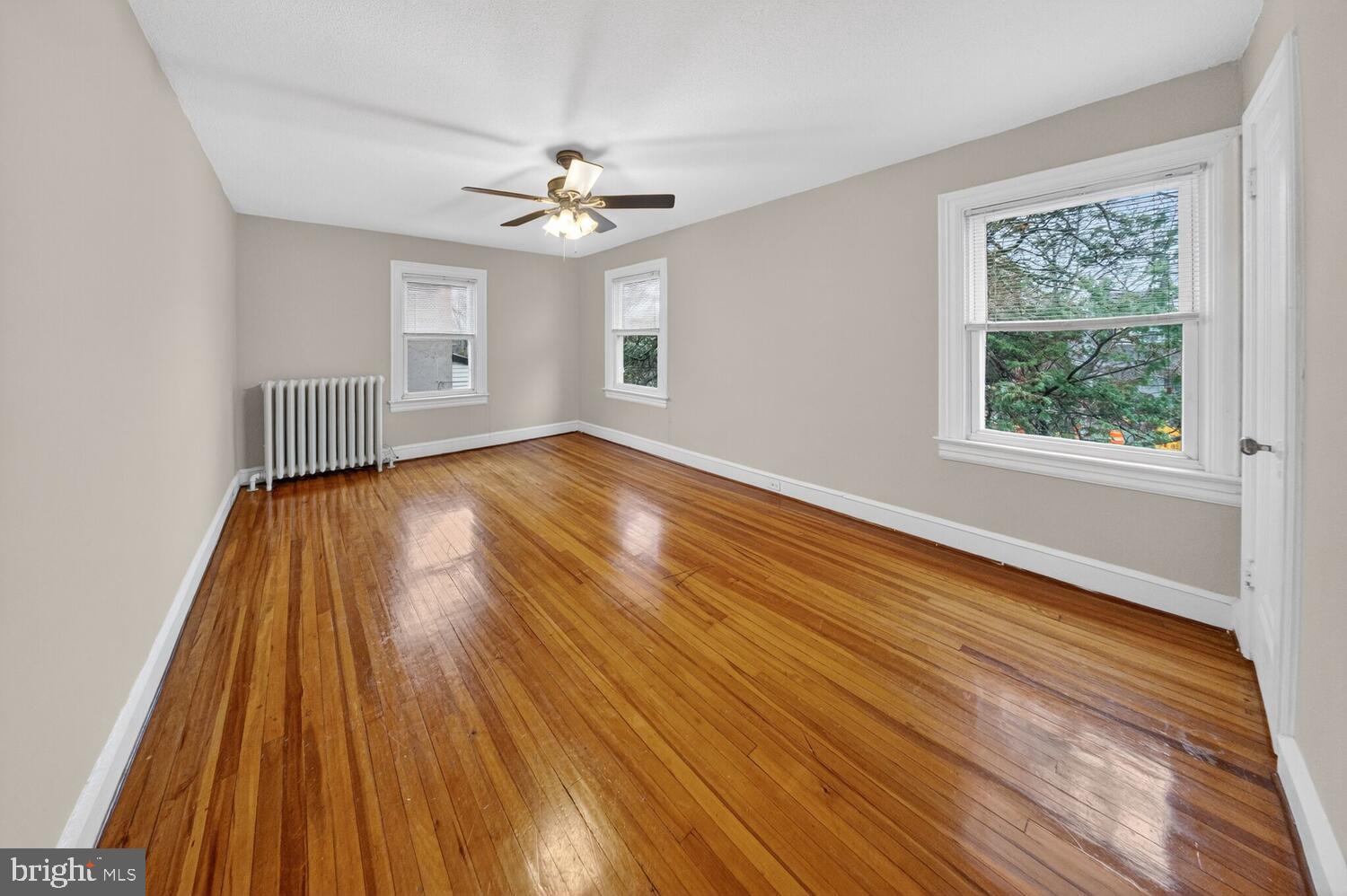 1353 Kennedy Street Northwest Washington, DC 20011 - Photo 12 of 32 a view of wooden floor and windows in a room
