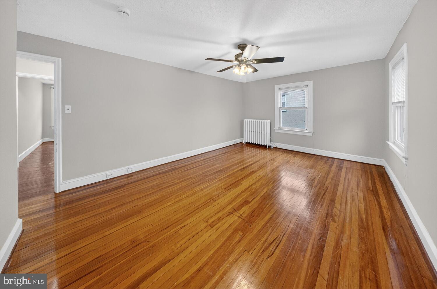 1353 Kennedy Street Northwest Washington, DC 20011 - Photo 14 of 32 a view of an empty room with wooden floor