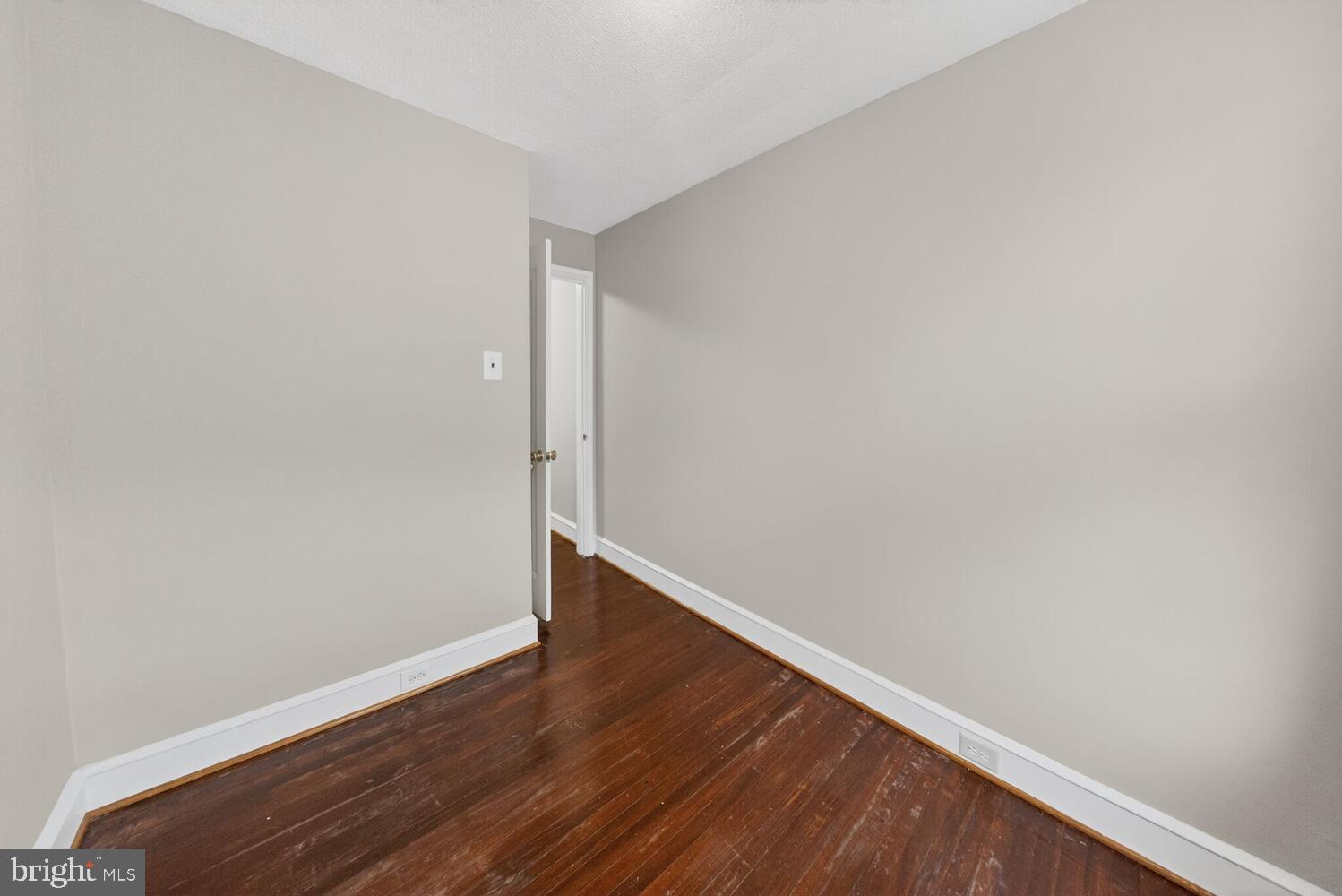 1353 Kennedy Street Northwest Washington, DC 20011 - Photo 17 of 32 a view of an empty room with wooden floor