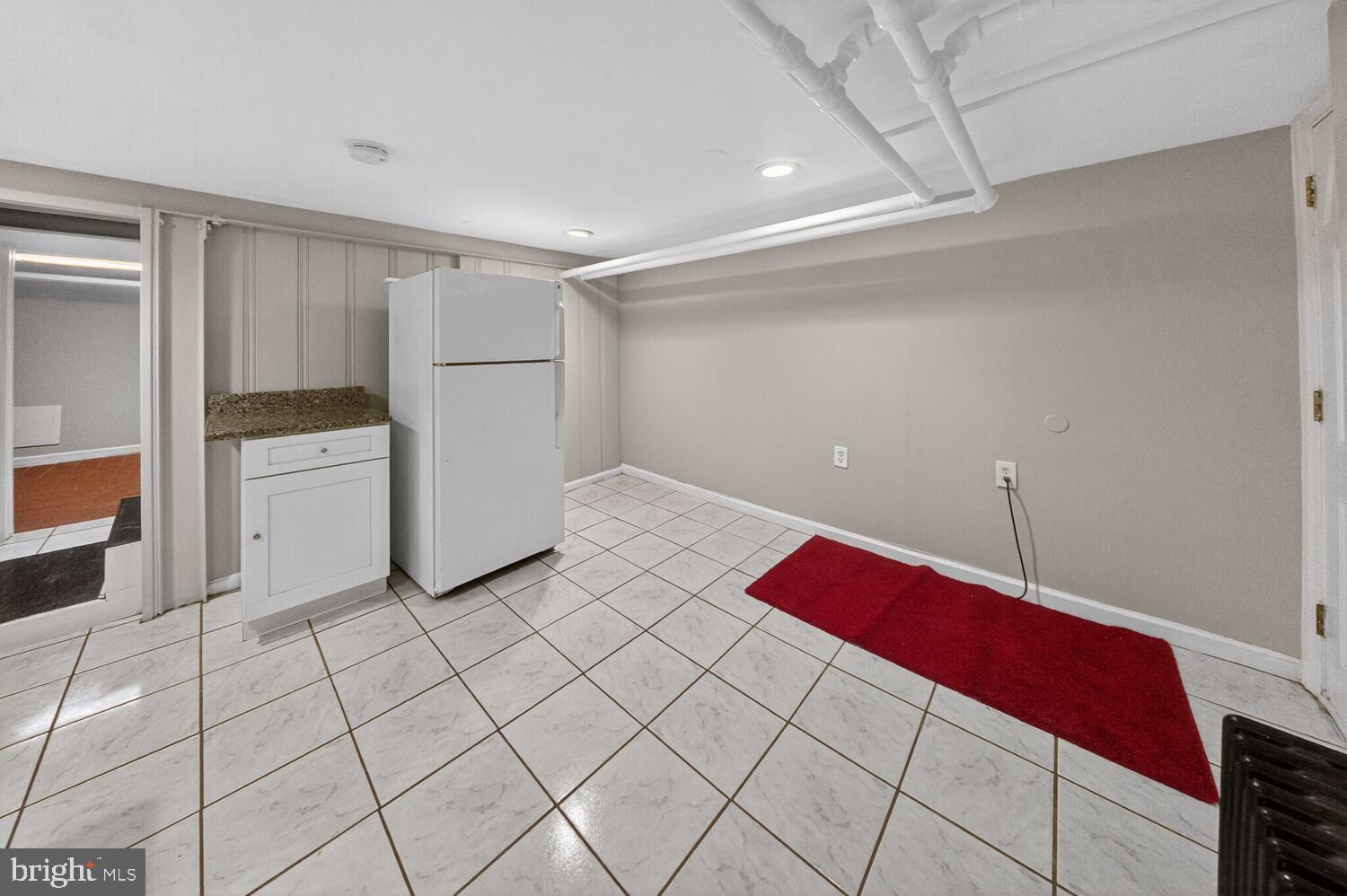 1353 Kennedy Street Northwest Washington, DC 20011 - Photo 23 of 32 a bedroom with a bed and a cabinets