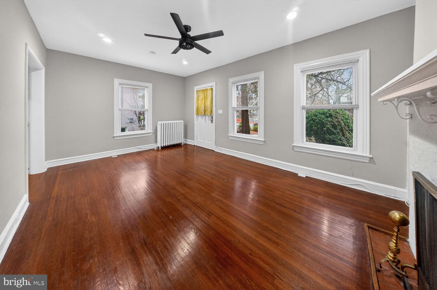 1353 Kennedy Street Northwest Washington, DC 20011 - Photo 4 of 32 a view of a big room with wooden floor and windows