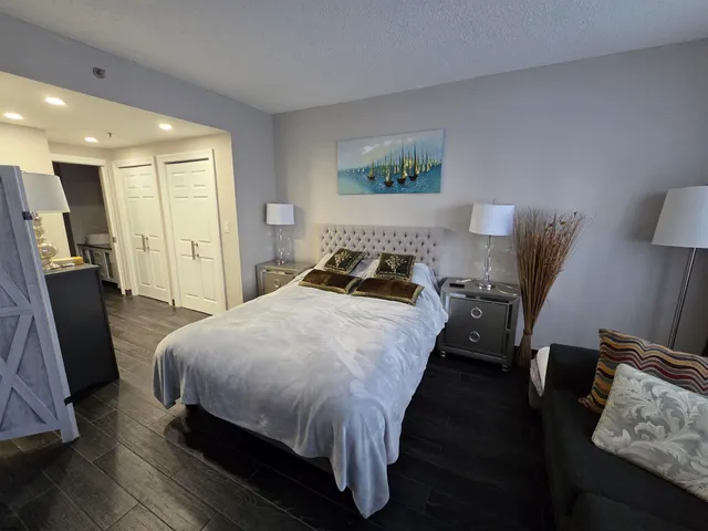 a bedroom with bed and window