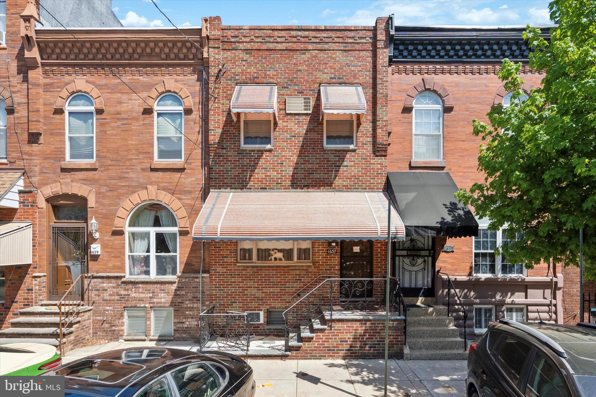 1637 West Ritner Street Philadelphia, PA 19145 - Photo 1 of 15 a front view of a building with parking space
