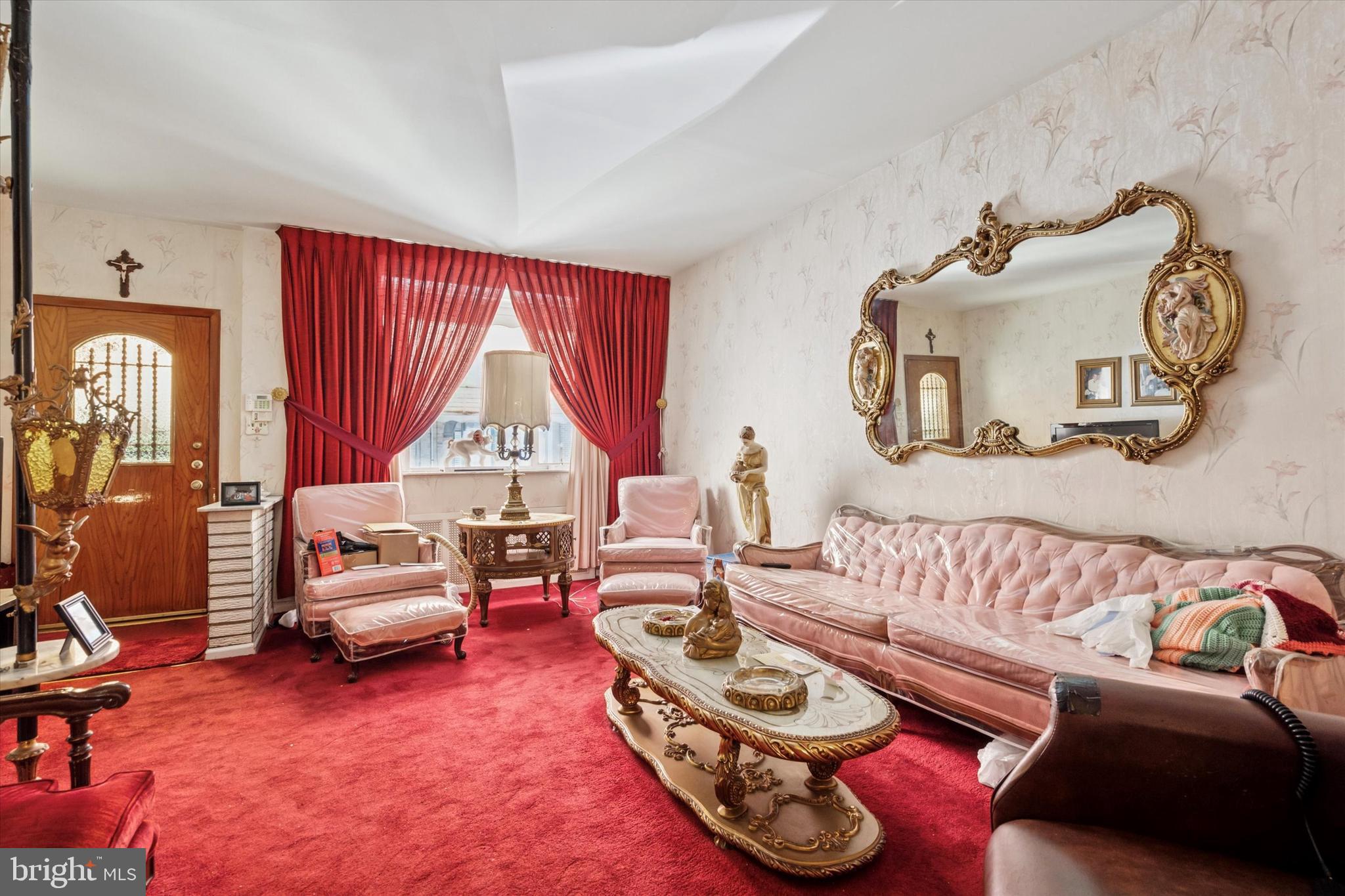 1637 West Ritner Street Philadelphia, PA 19145 - Photo 3 of 15 a living room with furniture and a window