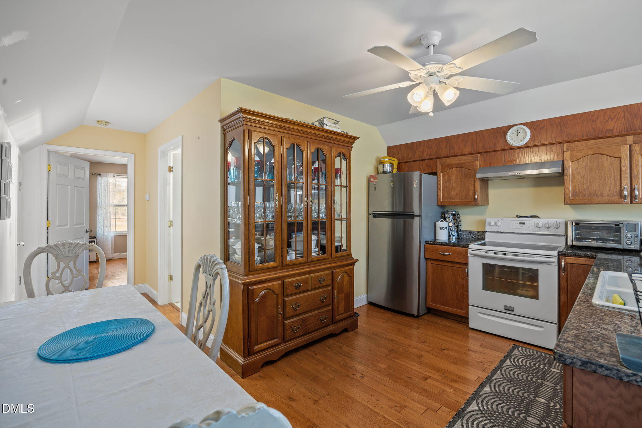 828 Chair Factory Road Nakina, NC 28455 - Photo 23 of 54 a kitchen with stainless steel appliances granite countertop a refrigerator a stove and a sink
