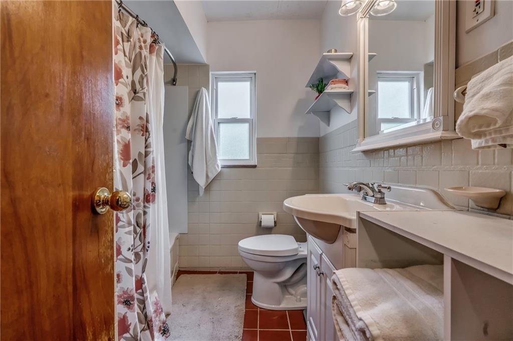 6 Virginia Terrace Pittsburgh, PA 15229 - Photo 20 of 23 a bathroom with a sink toilet and a mirror