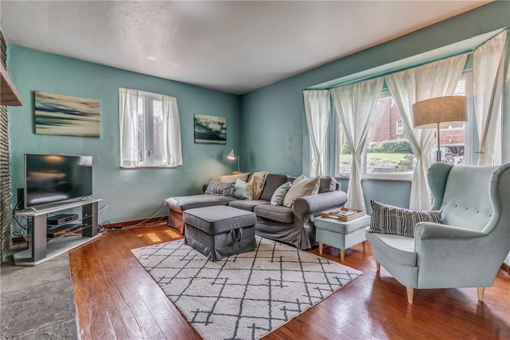 6 Virginia Terrace Pittsburgh, PA 15229 - Photo 7 of 23 a living room with furniture a large window and a flat screen tv