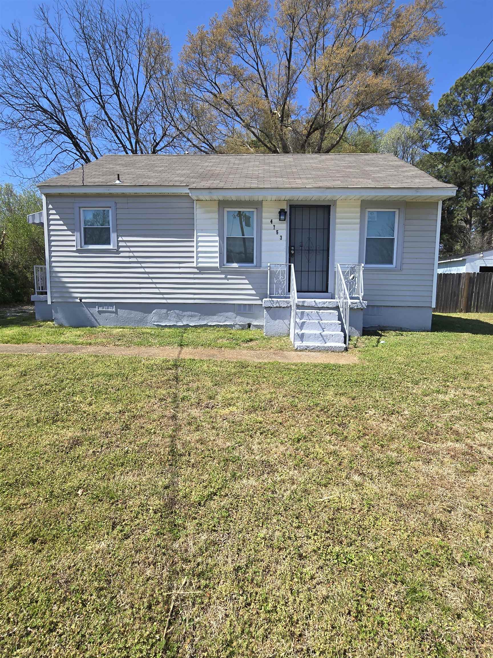 4753 Berta Road Memphis, TN 38109 - Photo 1 of 15 a view of a house with swimming pool next to a yard