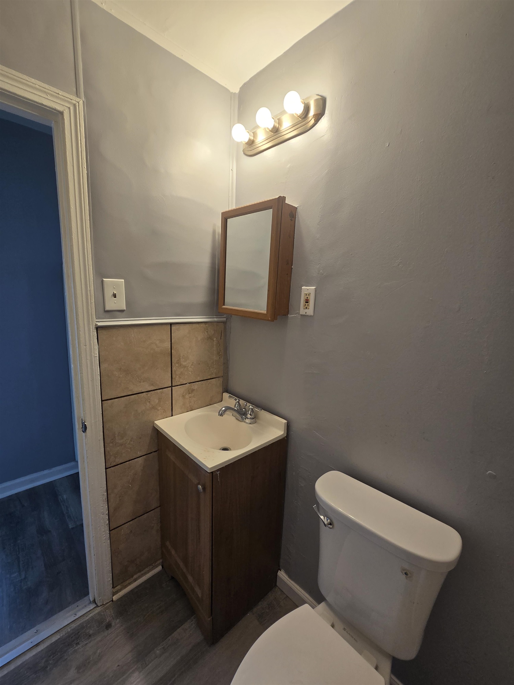 4753 Berta Road Memphis, TN 38109 - Photo 11 of 15 a bathroom with a toilet sink and mirror