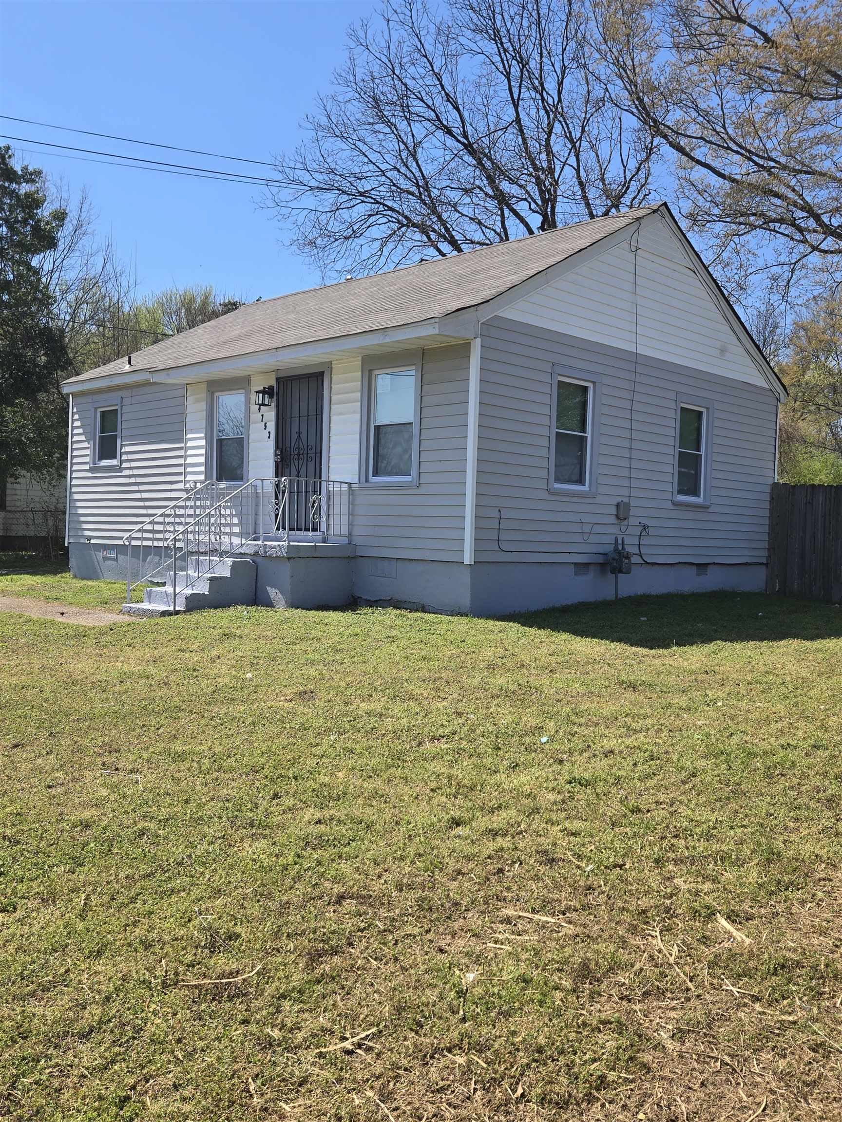 4753 Berta Road Memphis, TN 38109 - Photo 5 of 15 a view of a house with a yard