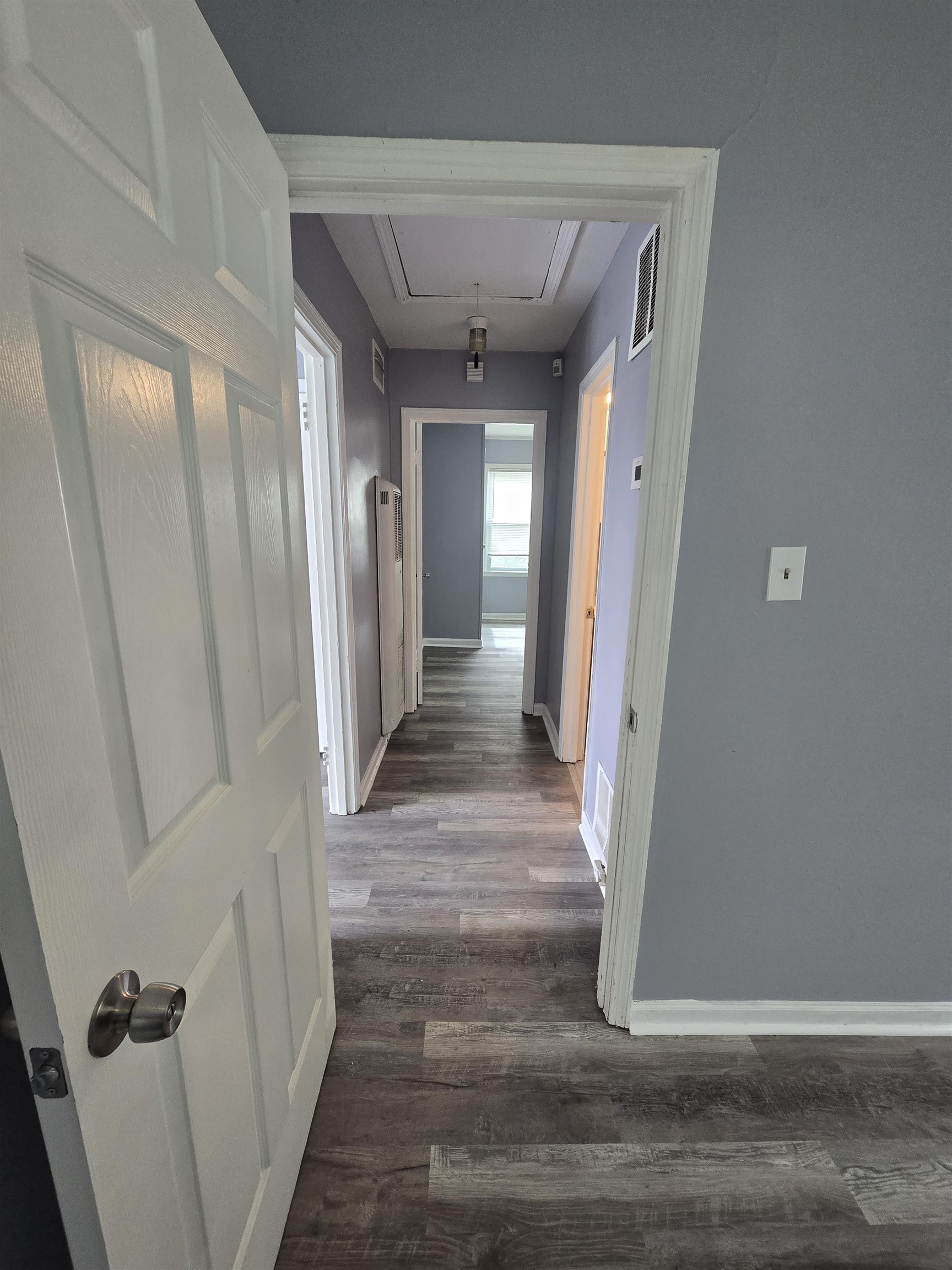 4753 Berta Road Memphis, TN 38109 - Photo 9 of 15 a view of a hallway with wooden floor and staircase