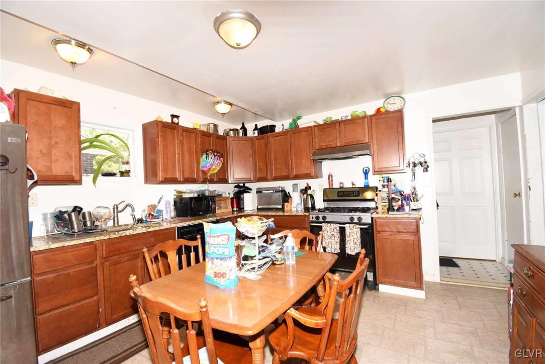 121 Main Street Hellertown, PA 18055 - Photo 12 of 29 a large kitchen with a table and chairs
