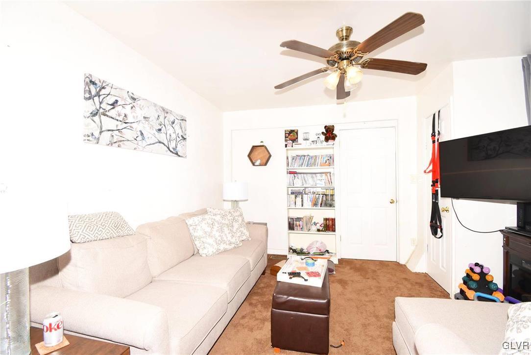 121 Main Street Hellertown, PA 18055 - Photo 13 of 29 a living room with furniture and a flat screen tv