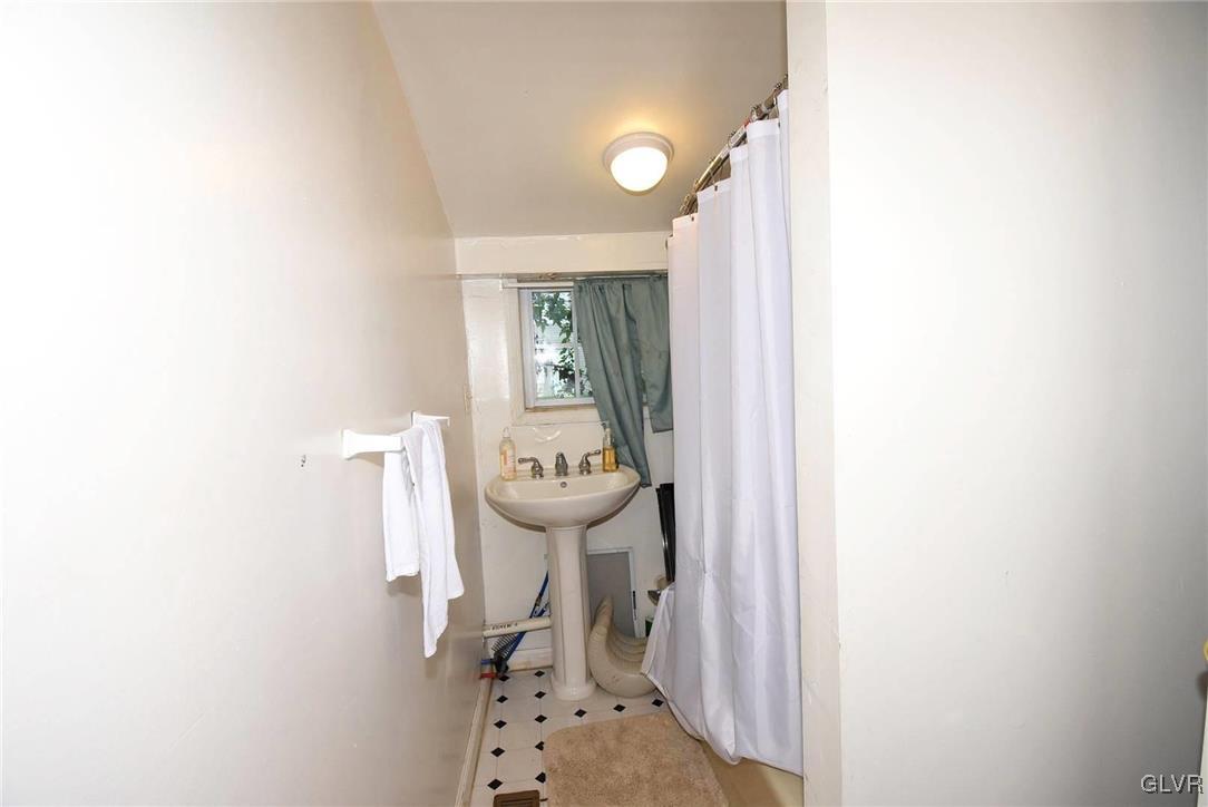 121 Main Street Hellertown, PA 18055 - Photo 16 of 29 a bathroom with a sink toilet and shower