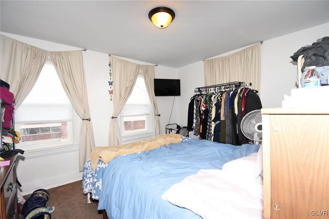121 Main Street Hellertown, PA 18055 - Photo 17 of 29 a bed room with a bed and a window