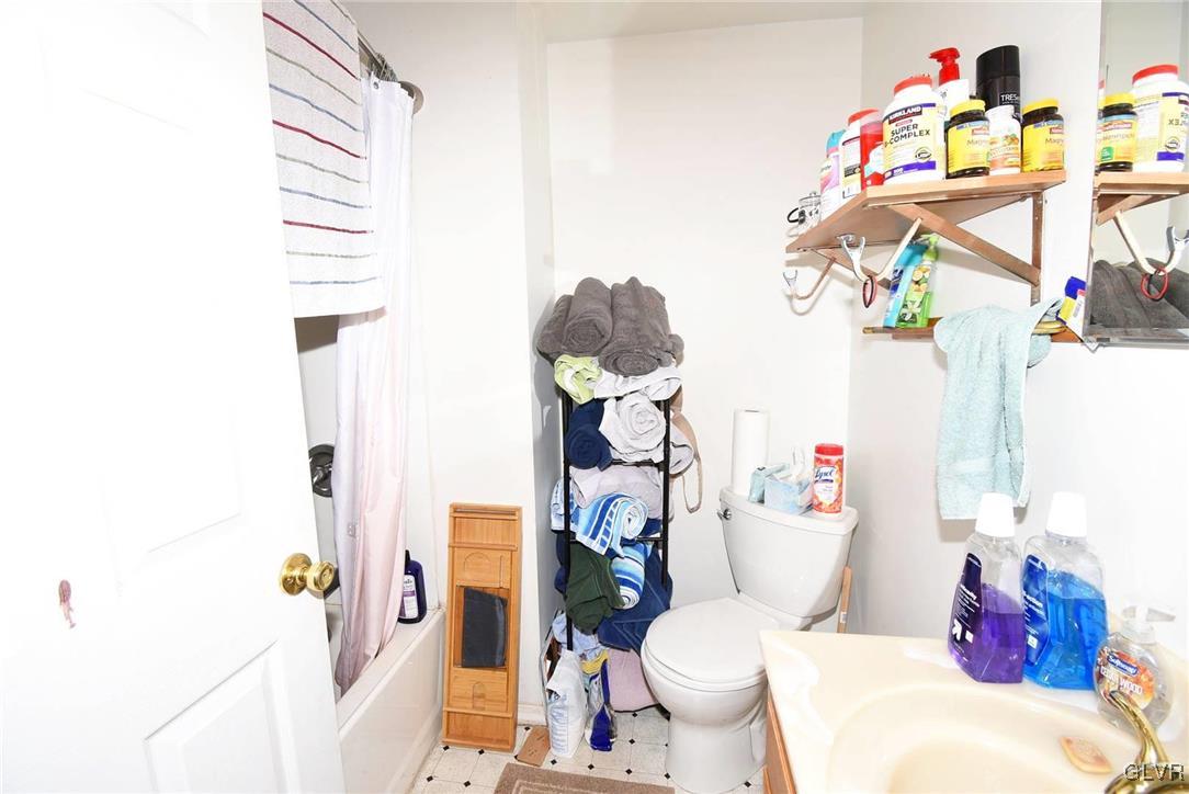 121 Main Street Hellertown, PA 18055 - Photo 18 of 29 a bathroom with a sink toilet and shower