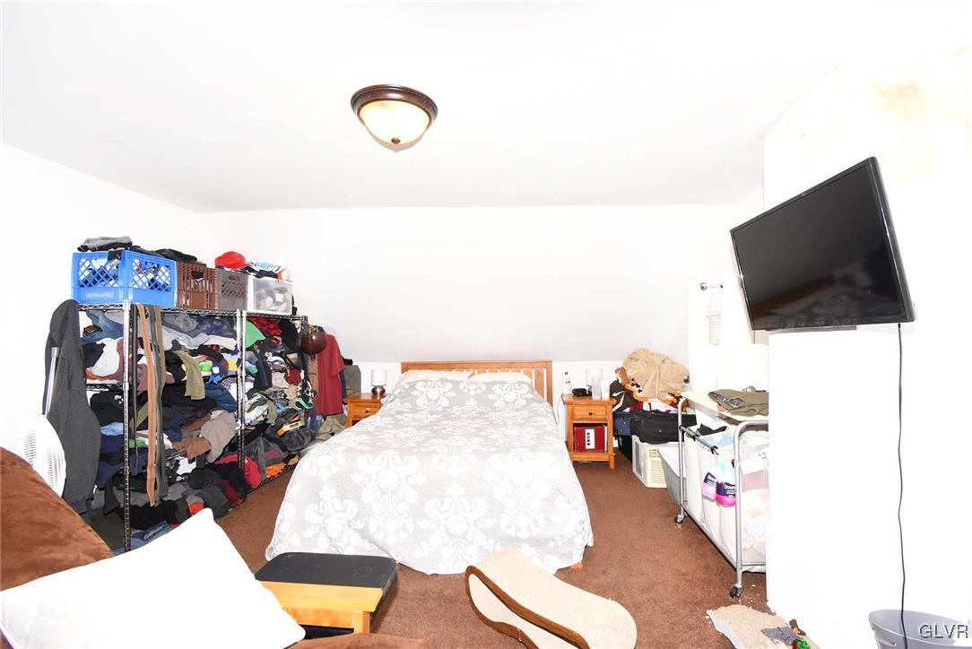 121 Main Street Hellertown, PA 18055 - Photo 20 of 29 a living room with furniture and a flat screen tv