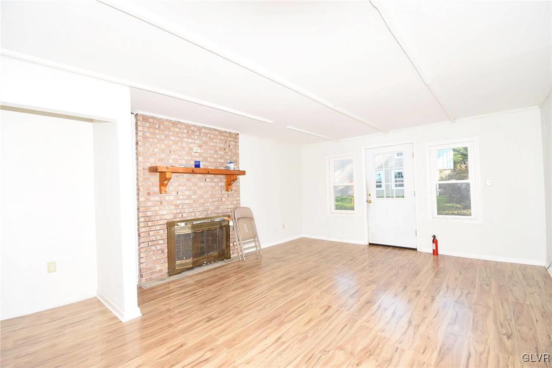 121 Main Street Hellertown, PA 18055 - Photo 2 of 29 a view of a kitchen with wooden floor and a window