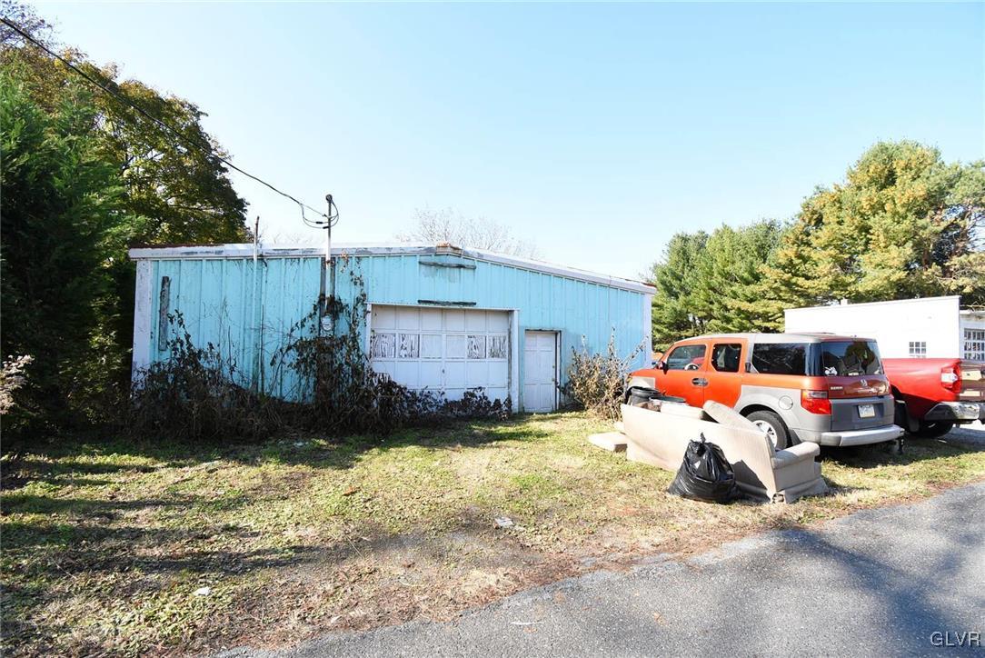 121 Main Street Hellertown, PA 18055 - Photo 23 of 29 a front view of a house with a yard