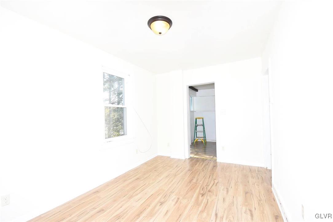 121 Main Street Hellertown, PA 18055 - Photo 4 of 29 a view of a room with wooden floor