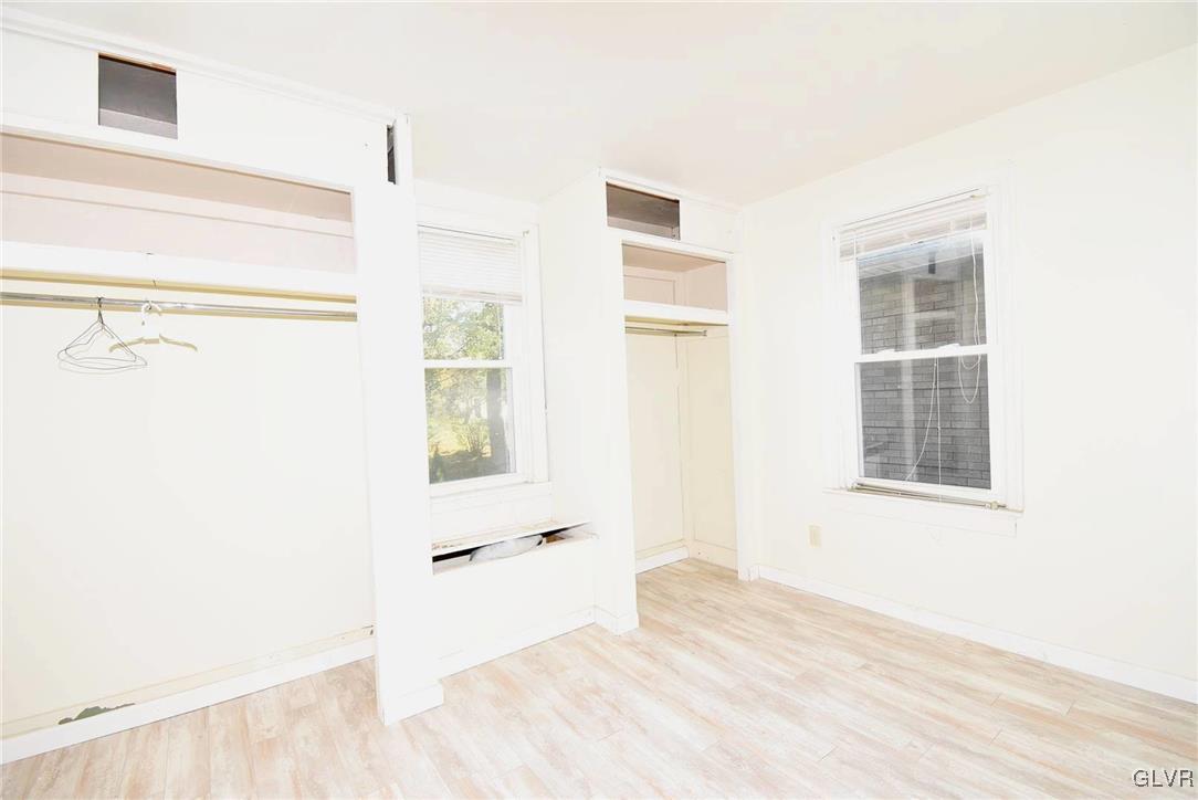 121 Main Street Hellertown, PA 18055 - Photo 6 of 29 a view of a bedroom with wooden floor and windows