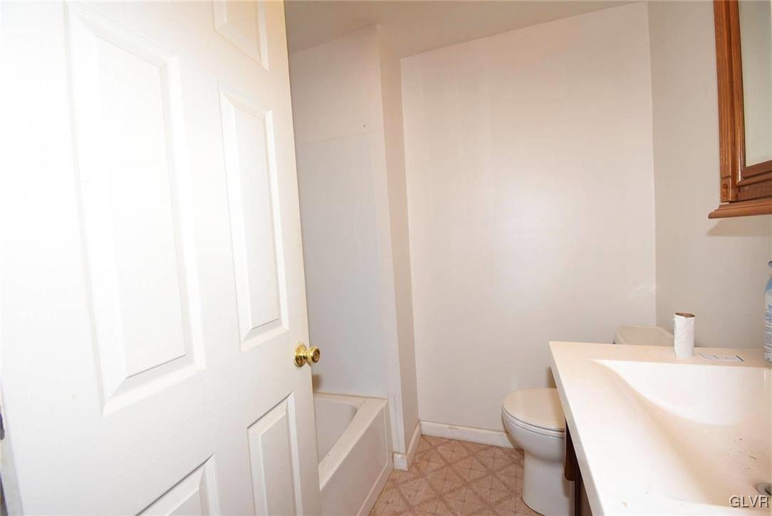 121 Main Street Hellertown, PA 18055 - Photo 8 of 29 a bathroom with a sink and a toilet