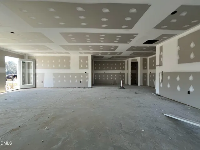 a view of empty room with a fireplace