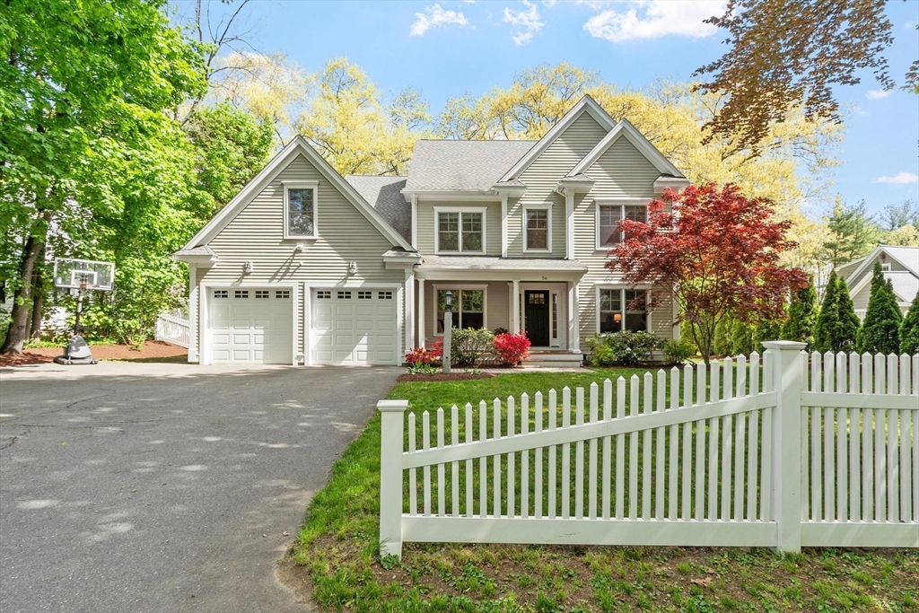 56 Old Marlboro Road Concord, MA 01742 - Photo 34 of 34 a front view of a house with a garden