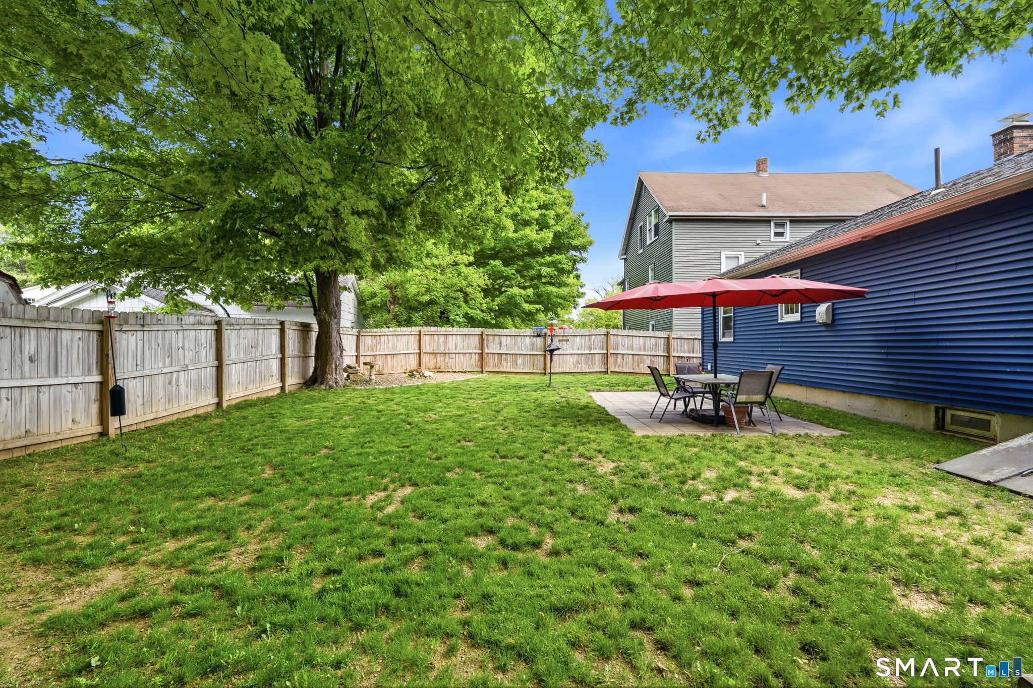 71 Smith Street Putnam, CT 06260 - Photo 21 of 25 a view of a house with a backyard