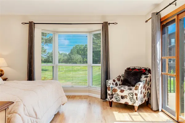 a bed room with a bed and a lamp