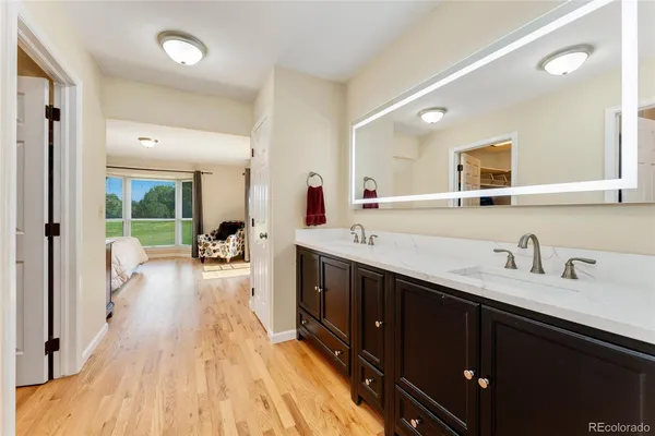a en suite bathroom with a sink and a mirror