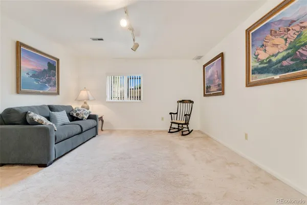 a view of an empty room with furniture and cabinet