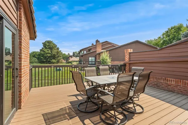 a view of a patio with wooden floor