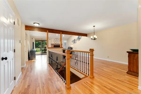 wooden floor in an empty room with a large window