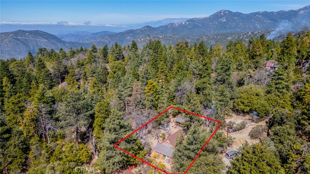 52647 Pine Cove Road Idyllwild, CA 92549 - Photo 33 of 35 a view of a lush green hillside and a houses
