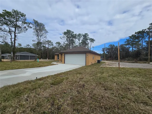 a large kitchen with kitchen island a sink stainless steel appliances and cabinets