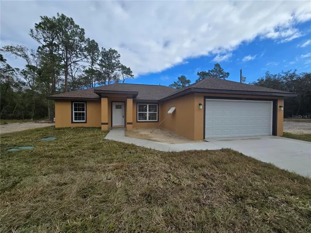 a kitchen with a stove and a refrigerator