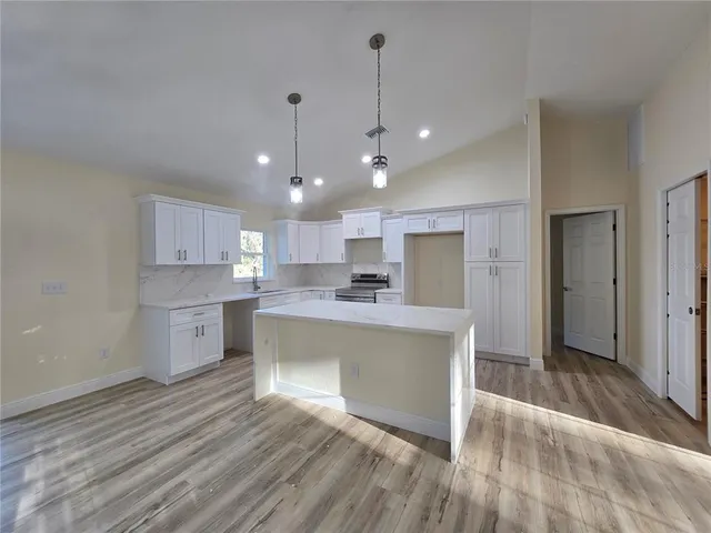 a bathroom with a double vanity sink toilet and shower