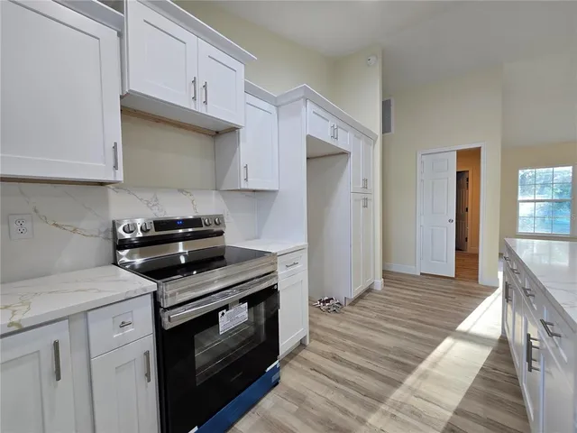 a room with linen closet and wooden floor
