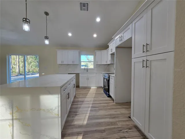 a view of empty room with ceiling fan