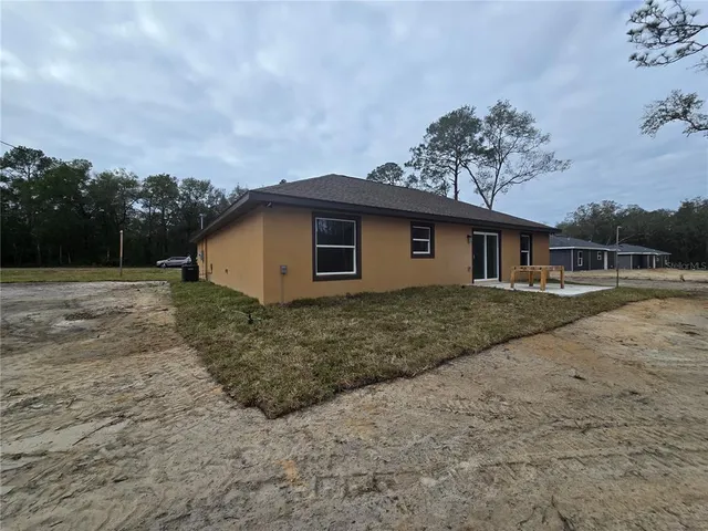 a view of large kitchen with wooden floor and outdoor space