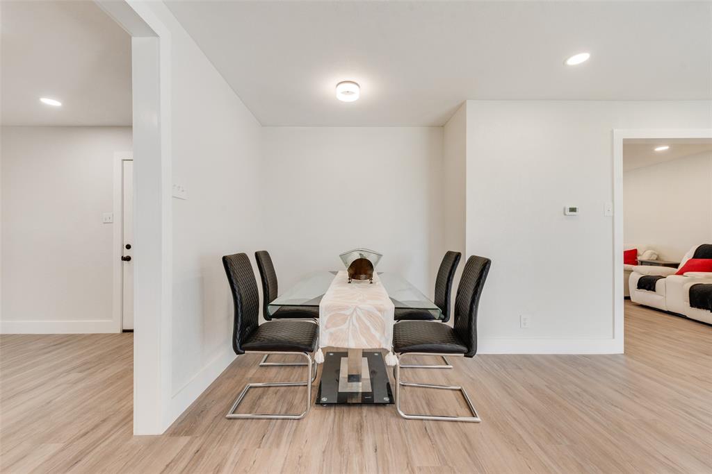 5311 Rocky Ridge Road Dallas, TX 75241 - Photo 12 of 24 a view of a dining room with furniture and wooden floor