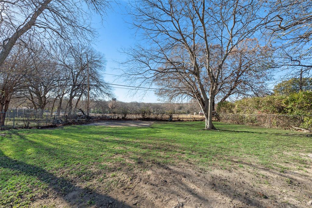5311 Rocky Ridge Road Dallas, TX 75241 - Photo 23 of 24 a backyard of a house with lots of green space