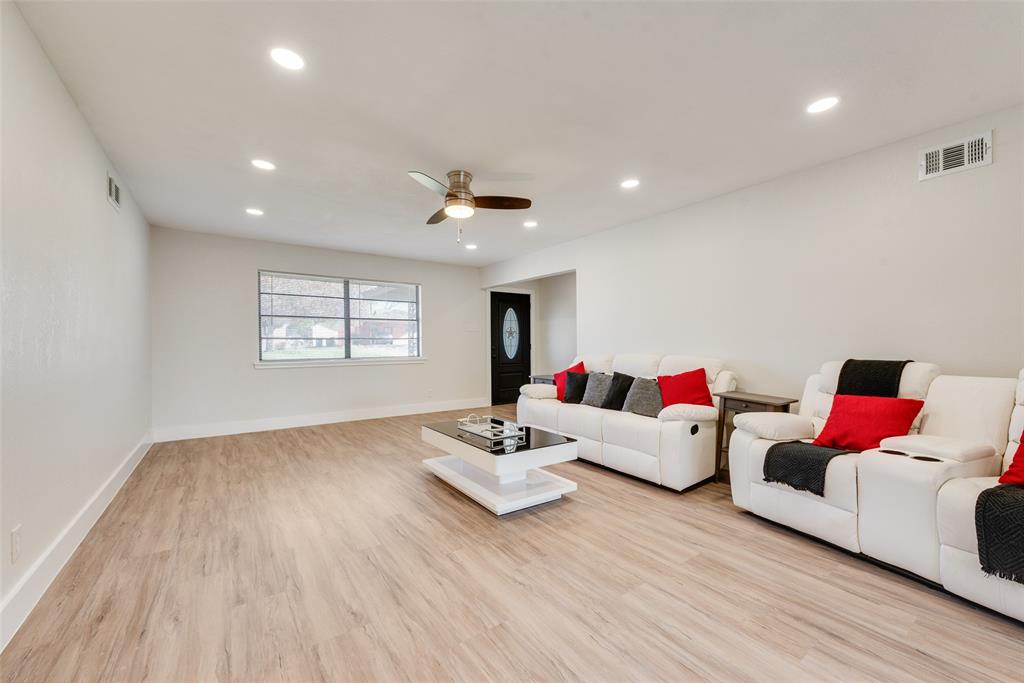 5311 Rocky Ridge Road Dallas, TX 75241 - Photo 6 of 24 a living room with furniture and a wooden floor